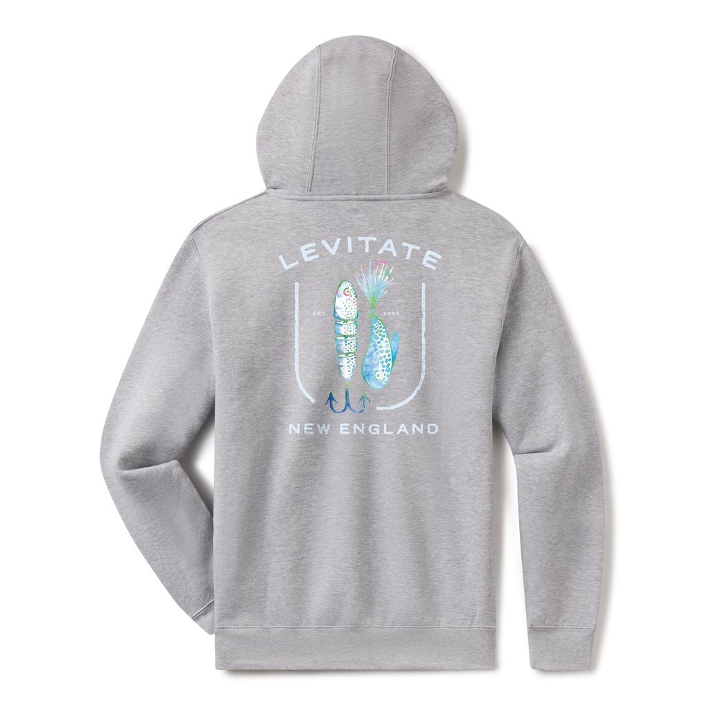 Levitate Lured In Hoodie, back: Jointed swimbait and bucktail fishing lures framed inside a fishhook with Levitate New England lettering