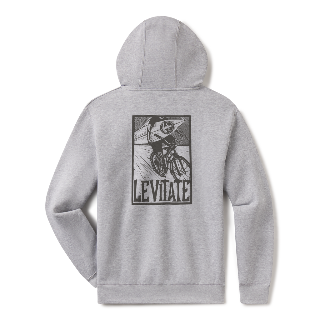 Levitate Blockprint Surfer Hoodie, back: Woodcut-style block print of a surfer riding a bicycle with a surfboard, Levitate lettering below