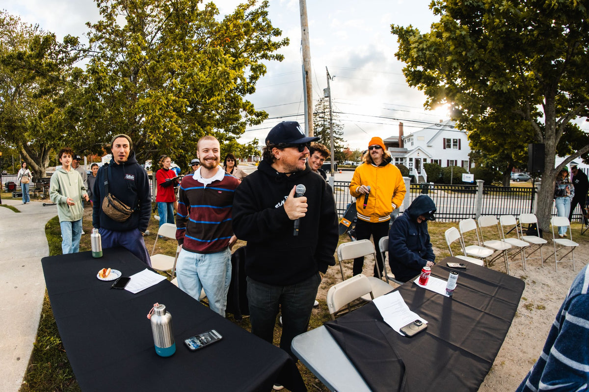 Member of The Elovaters on the mic trackside during the Shark Belly Classic