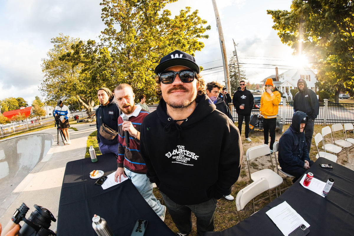 Member of The Elovaters in sunglasses and a black Elovaters hoodie at the Shark Belly Classic
