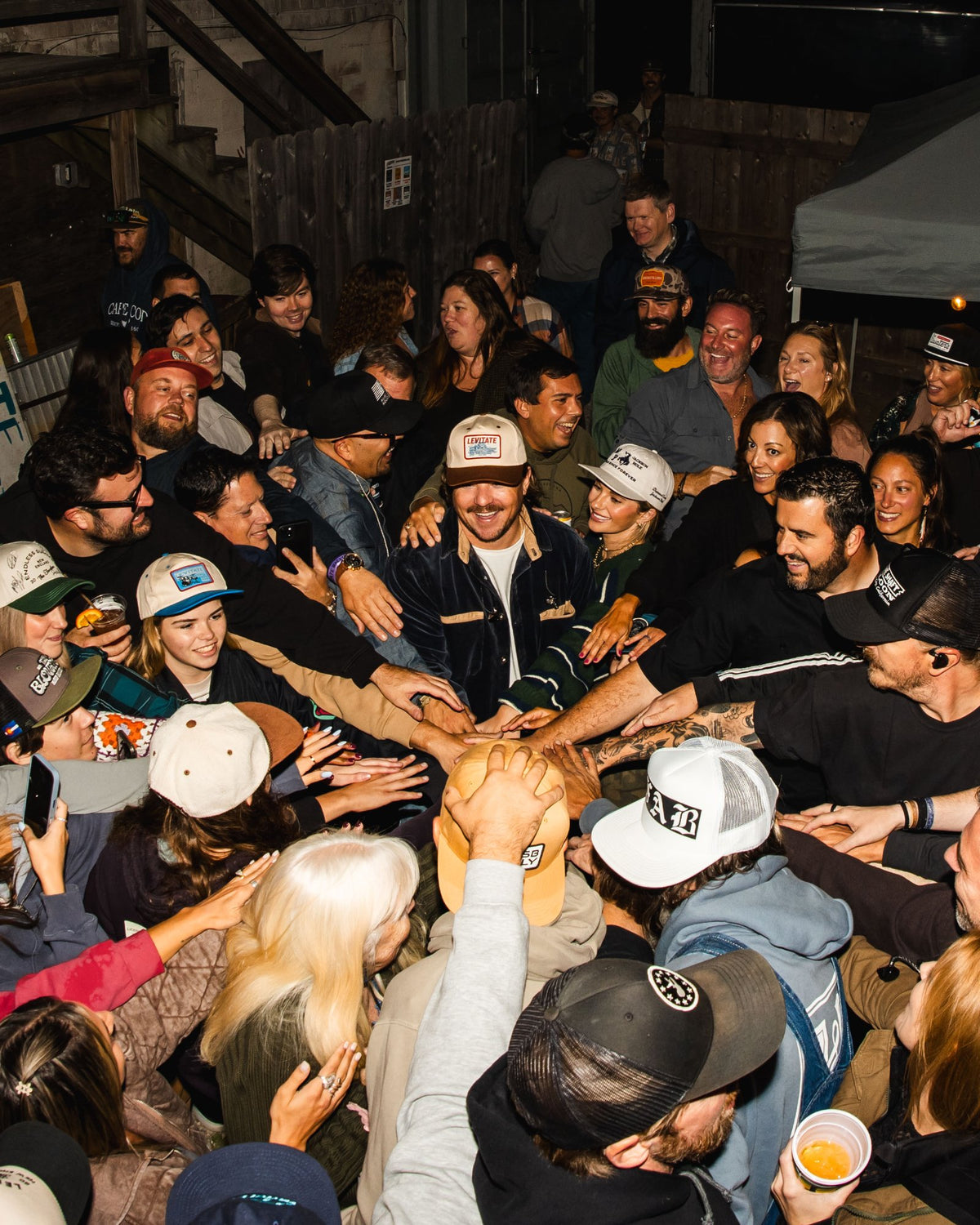 Fans and band gathered in a tight huddle in the Backyard on night two