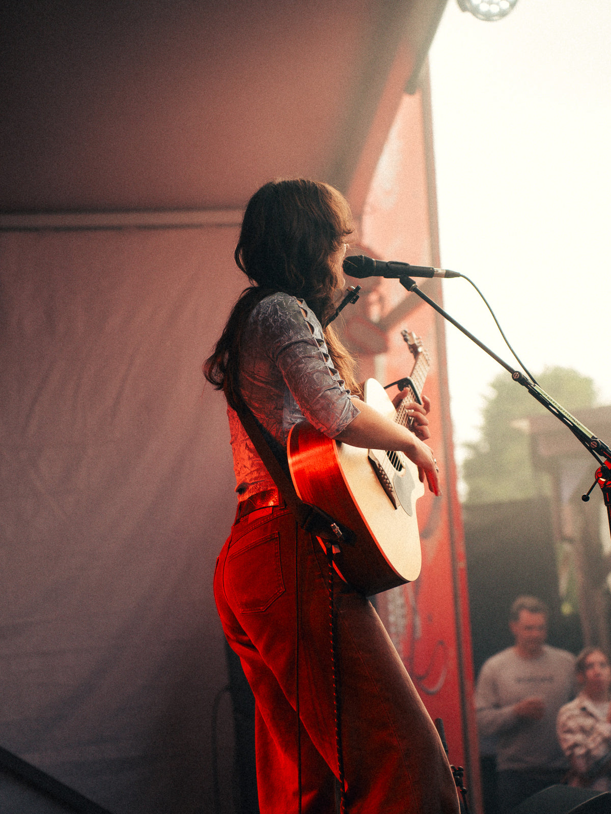 Steph Strings performing in warm late afternoon light at Cisco Brewers on Nantucket